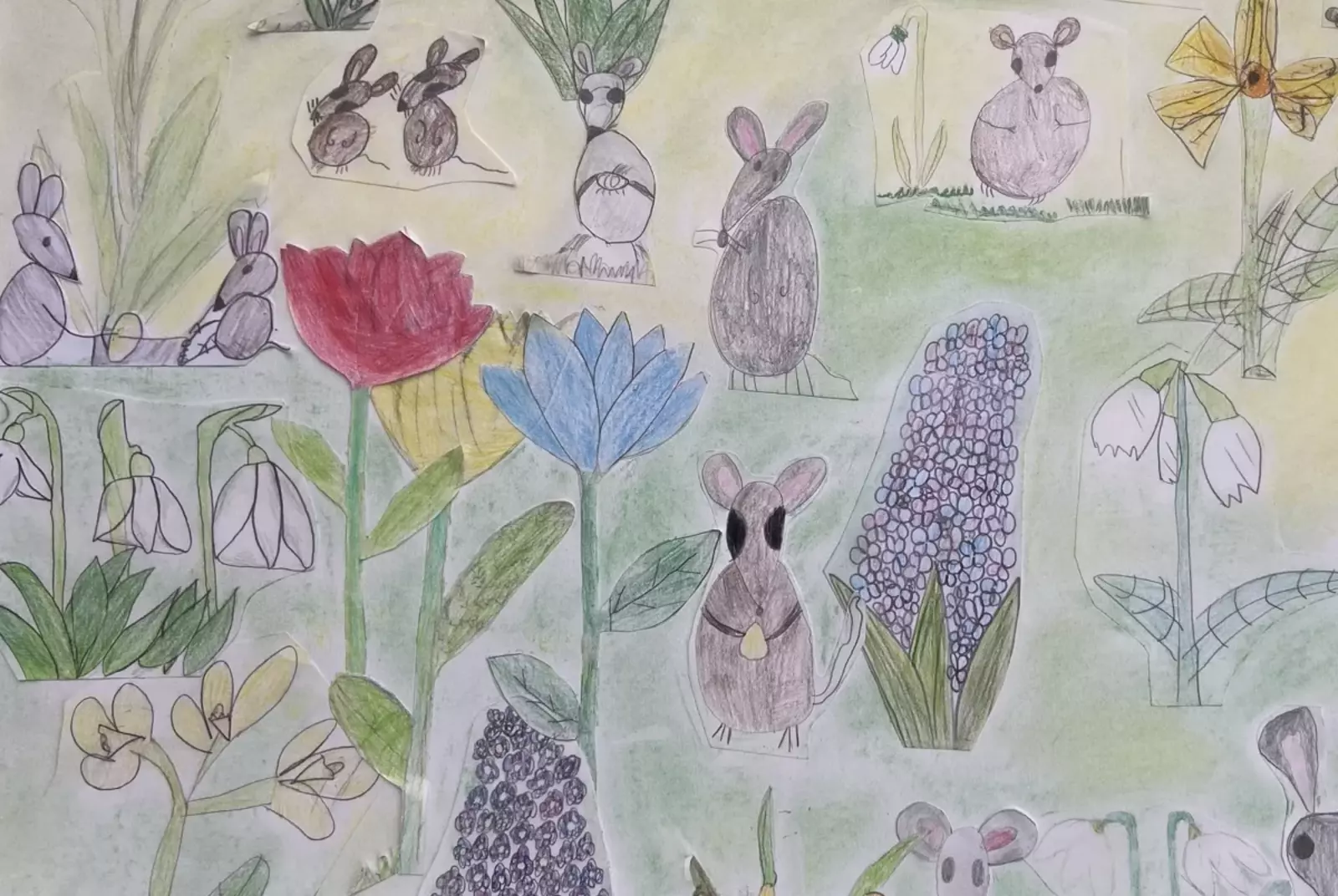 von Schülern gemalte Frühlingswiese mit bunten Blumen